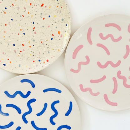 Expertly handcrafted and designed, this 10.5" hand-painted and handmade ceramic plate is perfect for all your party needs. Its larger size allows for easy sharing with friends, while the vibrant and colorful design adds a touch of elegance to any gathering. Impress your guests with this unique and functional piece.