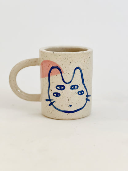 Introducing our Large Little Four Eyes Handmade Ceramic Mug, featuring our signature design inspired by our adorable and beloved pet, Bowl. This cute and unique mug is perfect for pet lovers. Handcrafted with care, it's the perfect addition to your morning routine. Brighten up your day with every sip!