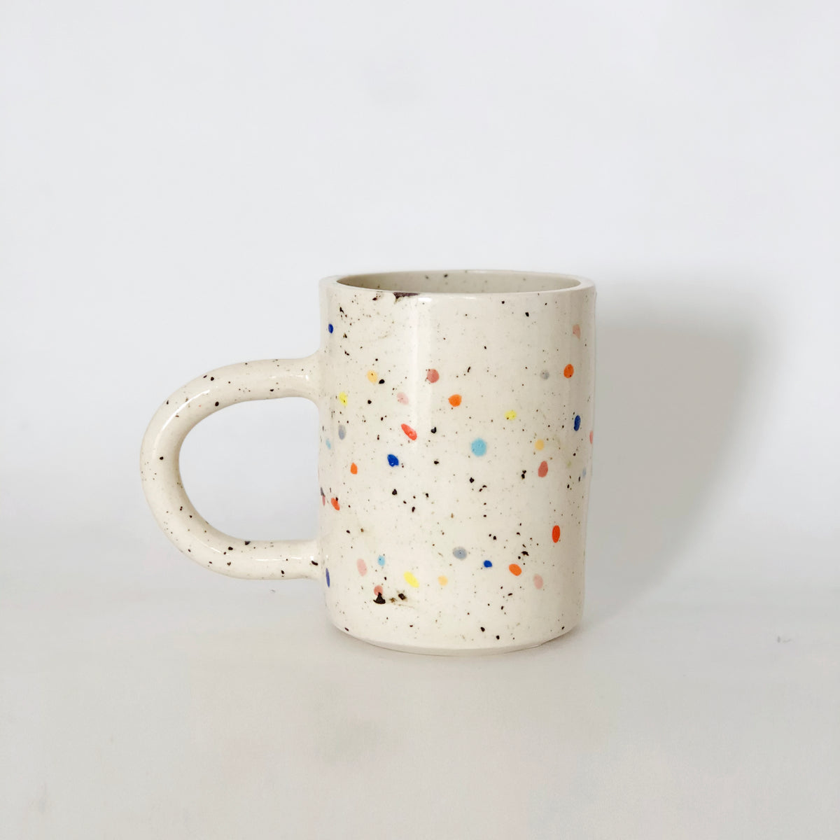 Add a pop of color to your morning routine with our Large Double Sprinkles Handmade Ceramic Mug! This bestselling design features double sprinkles, adding a touch of fun and happiness to your daily coffee or tea. Made with chic and vibrant colors, this mug is sure to keep your vibes high throughout the day.